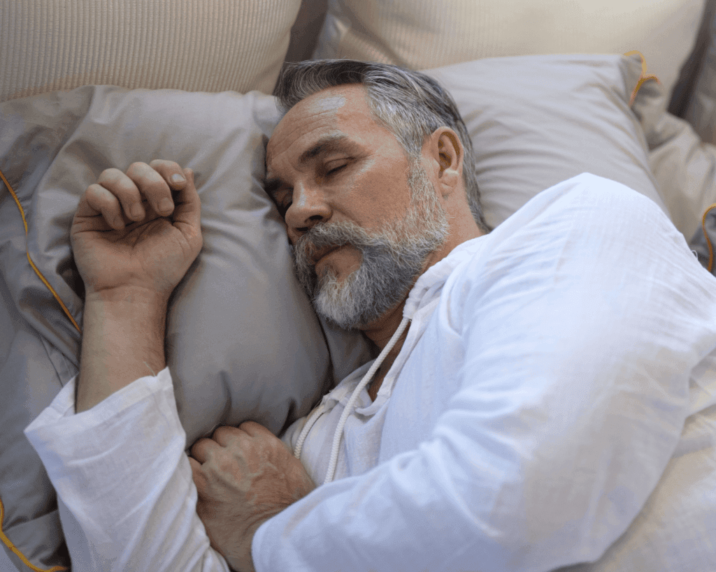 man sleeping in bed
